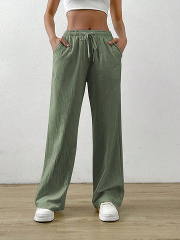 Pantalones flojos rectos y de lino de color albaricoque con cintura elástica y bolsillos inclinados