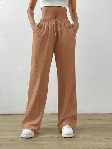 Pantalones flojos rectos y de lino de color albaricoque con cintura elástica y bolsillos inclinados