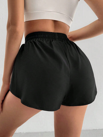 Shorts deportivos sueltos de unicolor para mujer con cintura elástica