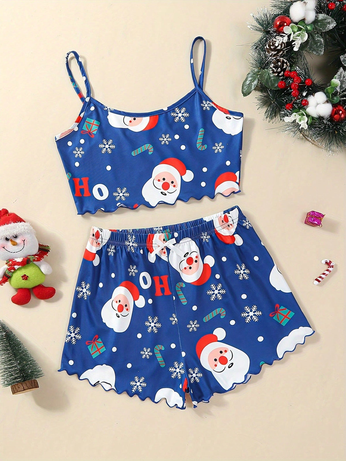 Conjunto de pijama con diseño de Papá Noel y copos de nieve