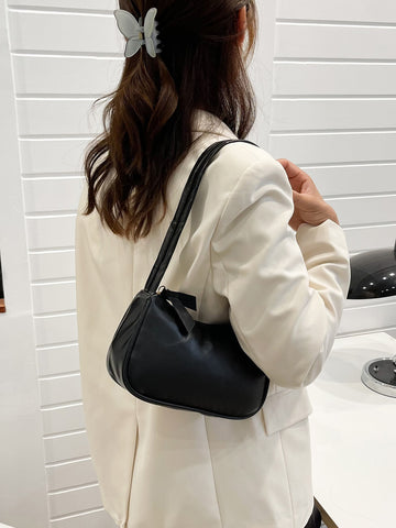 Bolso baguette minimalista