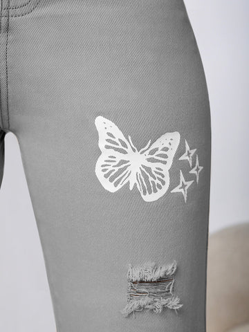 Jeans con mariposa con diseño roto con lavado