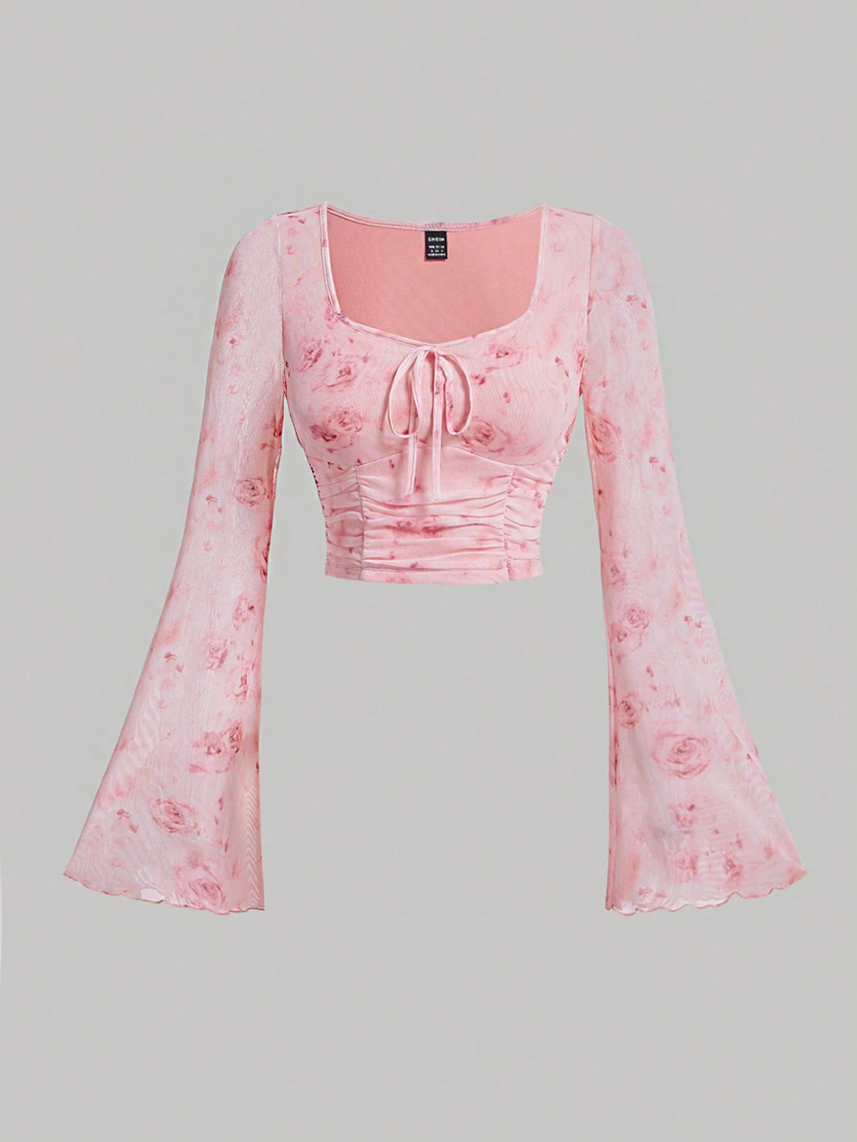 Top crop de tie dye con nudo delantero de manga con volante