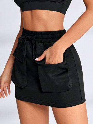 Skort deportivo de cintura ancha fruncido con bolsillo para teléfono